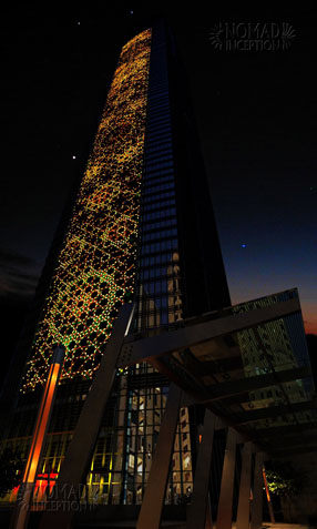 Tower façade with illuminated interlaces