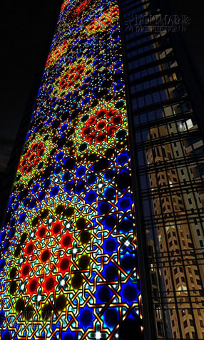 Tower façade with illuminated design rosettes