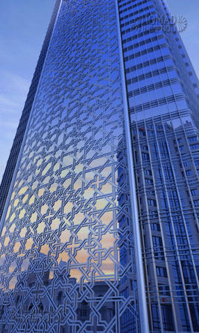 Islamic geometric design on tower façade in daylight close-up